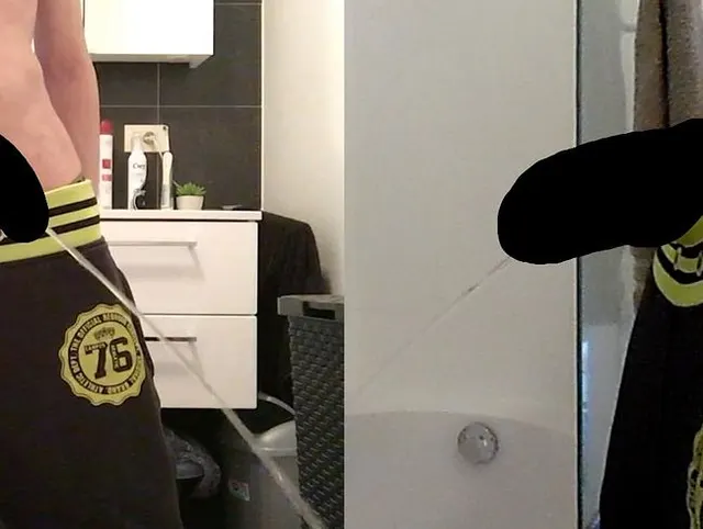 ********** boy is urinating in the bathroom