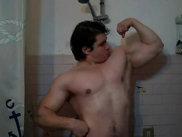 hot ***** flex his muscles in the shower